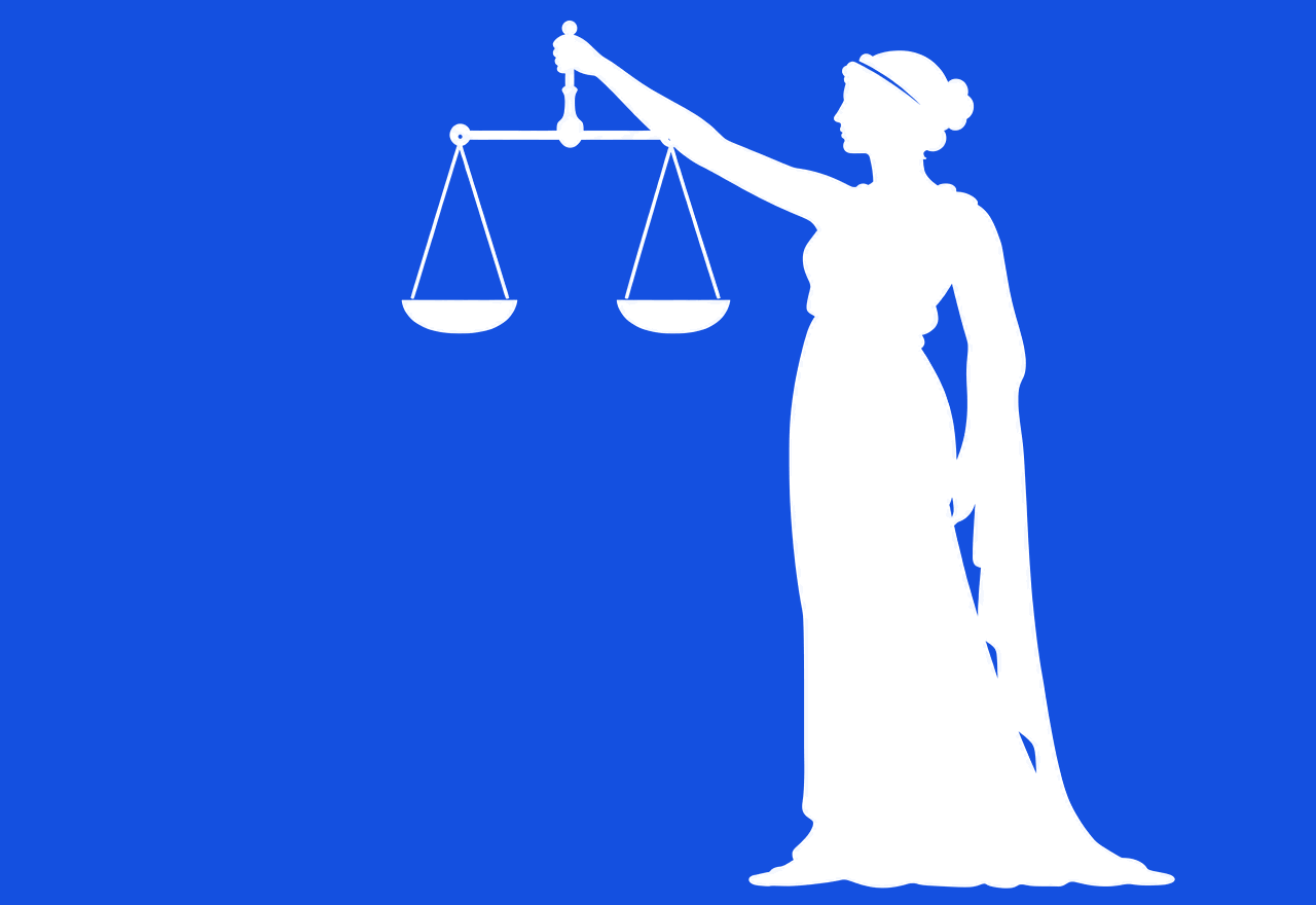 Silhouette of Themis, the Greek goddess of justice, holding balanced scales